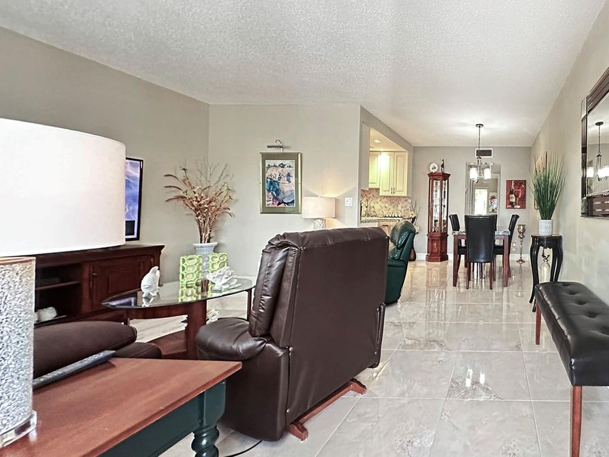 A BEAUTIFUL WATERVIEW FROM A CUSTOM CONDO IN WESTBURY F! FANTASTIC LOCATION! WALK TO POOL & PLAZA!THIS GORGEOUS 1 BEDROOM, 1.5 BATH IS FULLY FURNISHED W/ PORCELAIN TILE THRU-OUT!! VERY BRIGHT & IMMACULATE! UPDATED KITCHEN FEATURES WOOD CABINETS, RECESSED LIGHTING, TILE BACKSPLASH & DOUBLE S.S. SINK! UPDATED PRIMARY & GUEST BATHS, TOO! THIS IS ONE YOU HAVE TO SEE!!  CENTURY VILLAGE EAST IS A 55+  GATED COMMUNITY WITH FREE TRANSPORTATION INSIDE AND OUT!! THEIR LAVISH CLUBHOUSE FEATURES CLASSES, CLUBS, FREE MOVIES, BROADWAY SHOWS & STATE OF THE ART GYM!!  10 MINUTES TO THE OCEAN! CLOSE TO FABULOUS SHOPPING, MAJOR HWYS AND GREAT RESTAURANTS!  ASSOC. CLAIMS 55+.