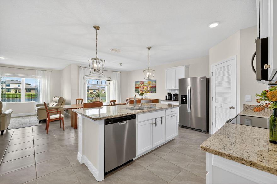 JUST REDUCED!!! Built in 2024, this stunning 4BR/2BA single-story home sits on an oversized lakefront lot in Central Park. Bright, open-concept design with tile in main areas, carpet in bedrooms, and upgraded baseboards. Modern kitchen with stainless steel appliances, large island, walk-in pantry, and stylish tile backsplash. Spacious primary suite with dual sinks and walk-in closet. Covered screened patio with beautiful lake views. Upgrades include granite countertops in both bathrooms, fenced backyard, aluminum gutters, fresh interior paint, closet tile, and updated lighting. Resort-style amenities. Low HOA $38.34/mo. Prime location near I-95 & US-1. See upgrades in documents.