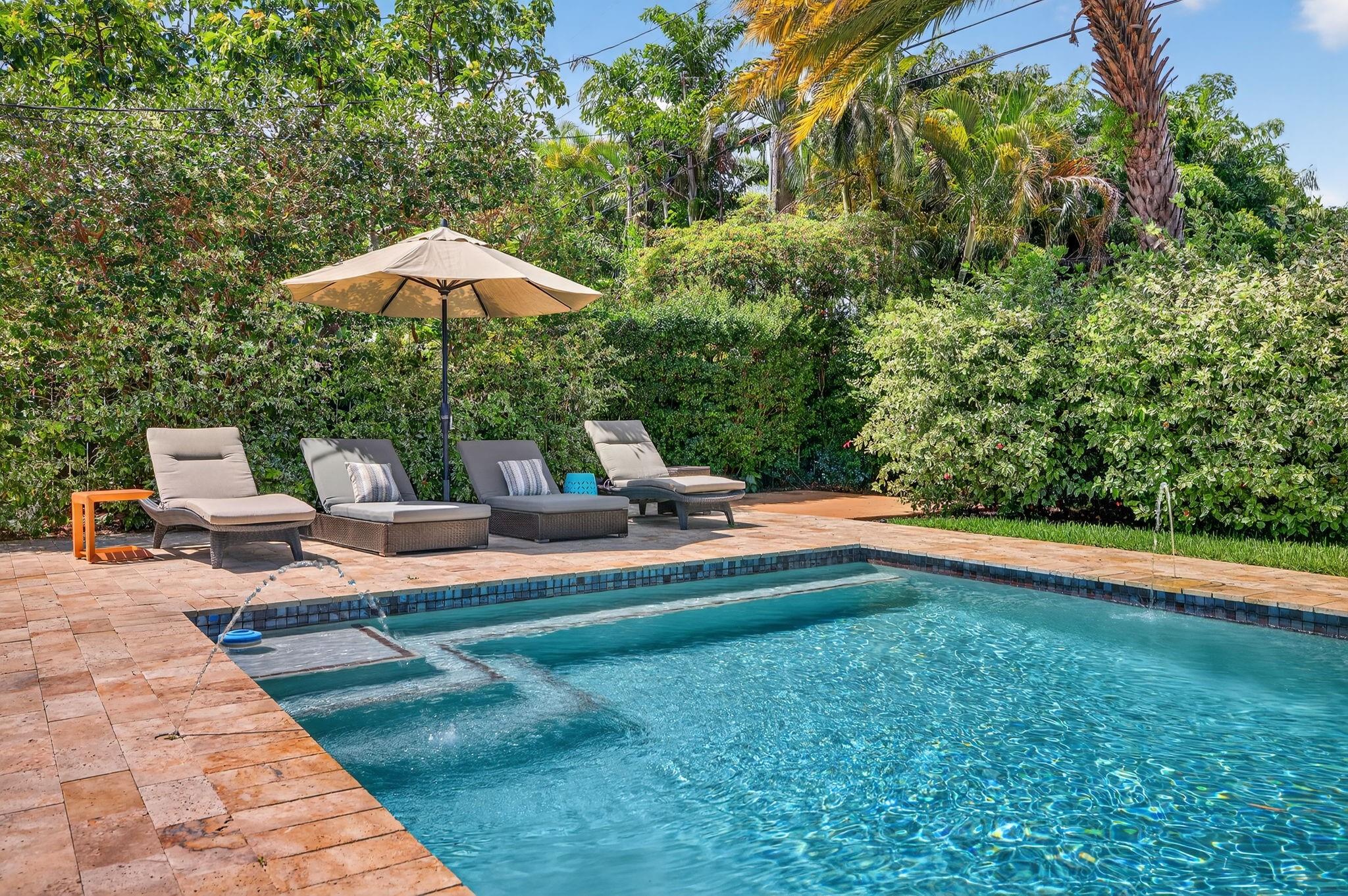 Modern Comfort Meets Tropical Charm in Sunset Manors with this beautifully upgraded home just steps from The Drive. Recent updates include brand-new metal roof with new trusses, hurricane-impact windows & doors, new A/C (2020), tankless water heater & PVC sewer lines to the street offering lasting comfort & peace of mind. An open layout flows into a gourmet kitchen with granite counters, stainless appliances & oversized island. Custom California Closets & guest room with built-in office & Murphy bed add function & flexibility. Heated saltwater pool with spa & deck jets surrounded by travertine pavers, lush landscaping & LED lighting; a true resort feel. Professionally painted inside & out, this move-in-ready home is the perfect retreat close to all the dining & nightlife of Wilton Manors.