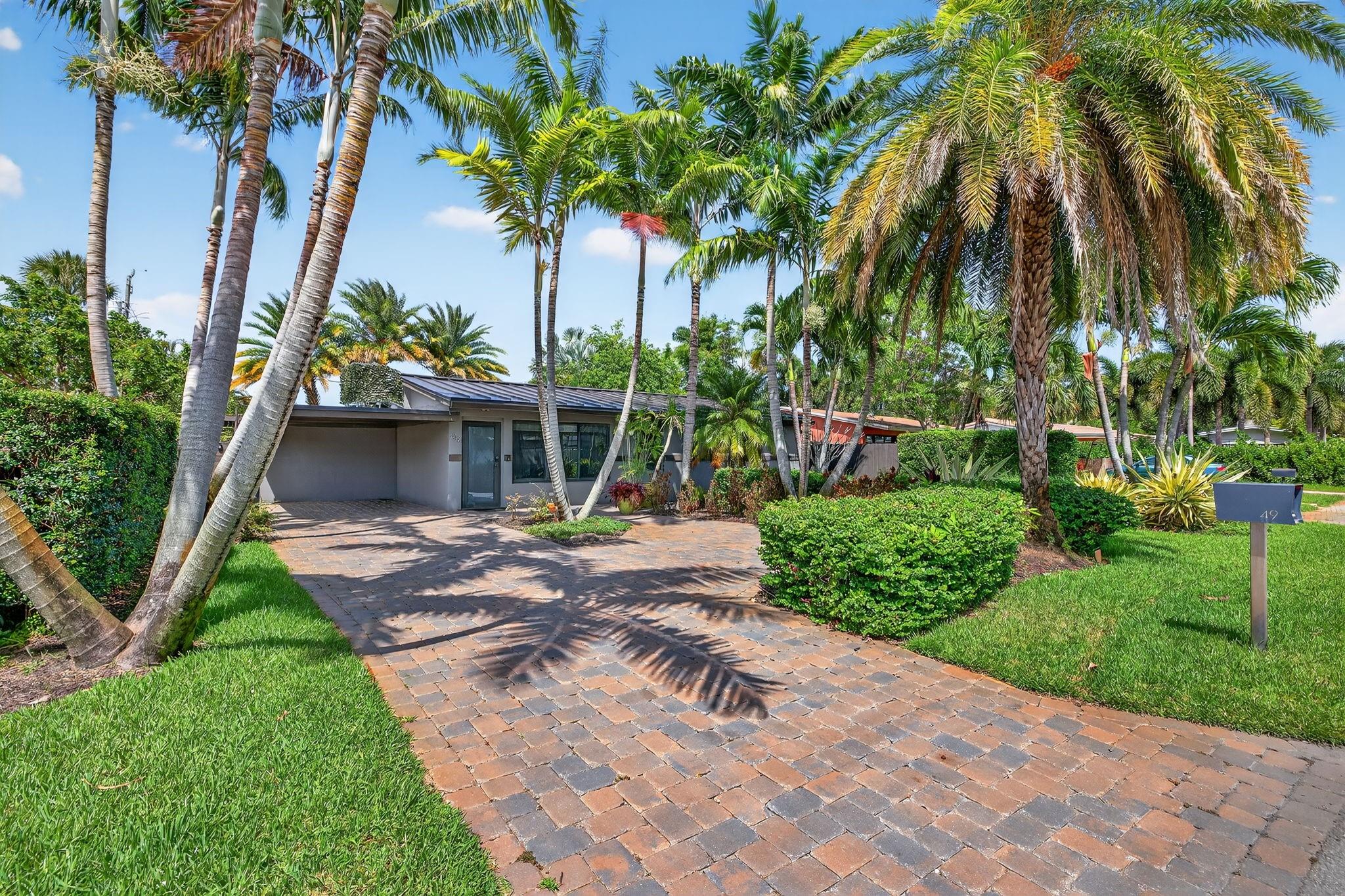 Modern Comfort Meets Tropical Charm in Sunset Manors with this beautifully upgraded home just steps from The Drive. Recent updates include brand-new metal roof with new trusses, hurricane-impact windows & doors, new A/C (2020), tankless water heater & PVC sewer lines to the street offering lasting comfort & peace of mind. An open layout flows into a gourmet kitchen with granite counters, stainless appliances & oversized island. Custom California Closets & guest room with built-in office & Murphy bed add function & flexibility. Heated saltwater pool with spa & deck jets surrounded by travertine pavers, lush landscaping & LED lighting; a true resort feel. Professionally painted inside & out, this move-in-ready home is the perfect retreat close to all the dining & nightlife of Wilton Manors.
