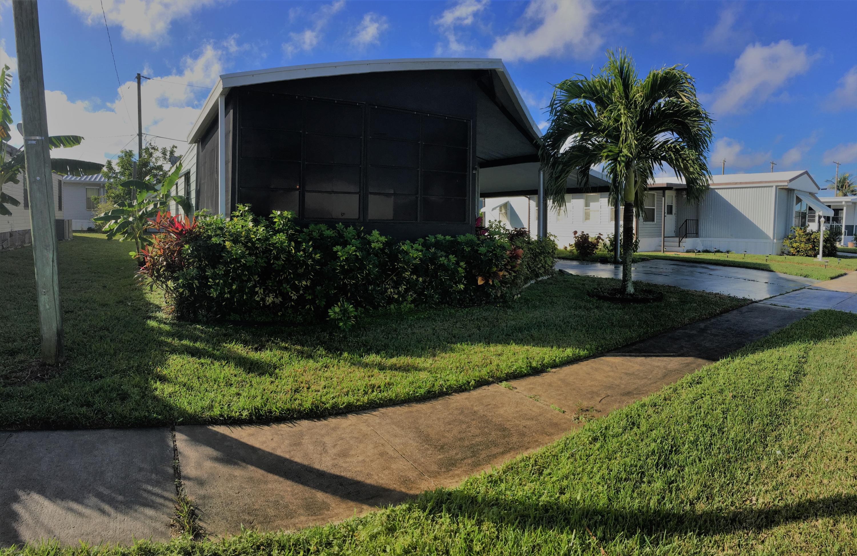 Beautifully furnished, move in ready double wide home with cathedral ceiling. Very popular floor plan, open and bright up with many windows. Large Florida room and 2 cars Carport. Turnkey, just move in, call for appointment. You own your deeded lot 55+ in community in Boynton Beach, FL.