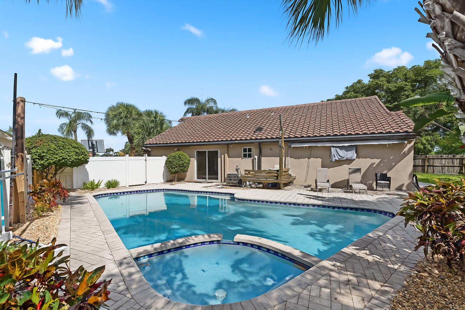 Available Now! Welcome to this upgraded 3-bedroom, 2-bathroom home with a desirable split-bedroom layout and 2-car garage in the gated community of Newport Cove. The oversized family room and spacious kitchen combined with the open floor plan, offers a bright, airy feel, making it an ideal family and entertaining space. One of the few homes in the community with its own private pool, this property is perfect for friends, family, and pets. The fully fenced backyard features a charming patio, ideal for relaxing and soaking in the Florida lifestyle. The kitchen boasts stainless steel appliances and granite countertops, while the laundry room offers a full-size washer and dryer. This community offers cable TV, a community pool, tennis courts, pickleball, and fitness center.
