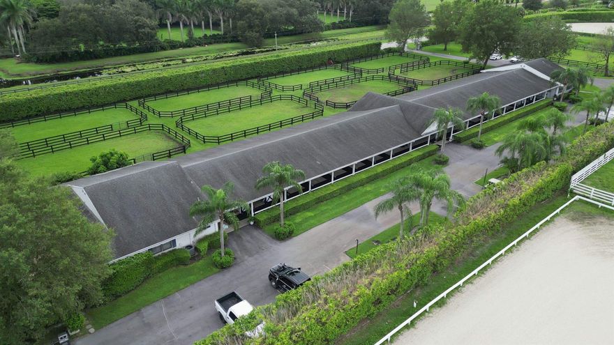 Beautiful 24 stall barn with 10 stalls available. Round pen and walker arena