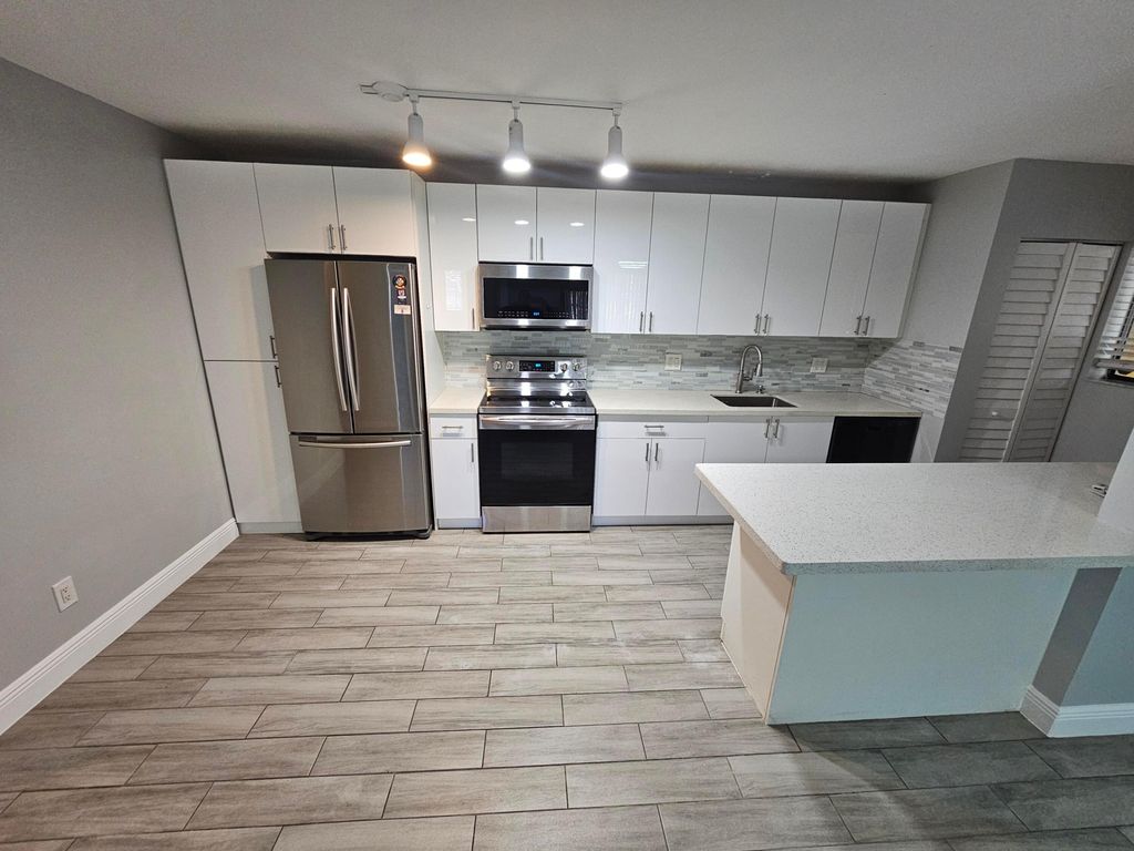 Photo of 677 Trace Cir #106, Deerfield Beach, FL 33441 (MLS # B26001014)