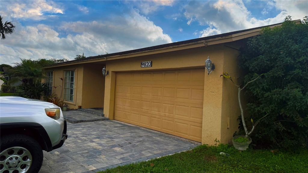 Photo of 9820 NW 24th St, Coral Springs, FL 33065 (MLS # F10540432)