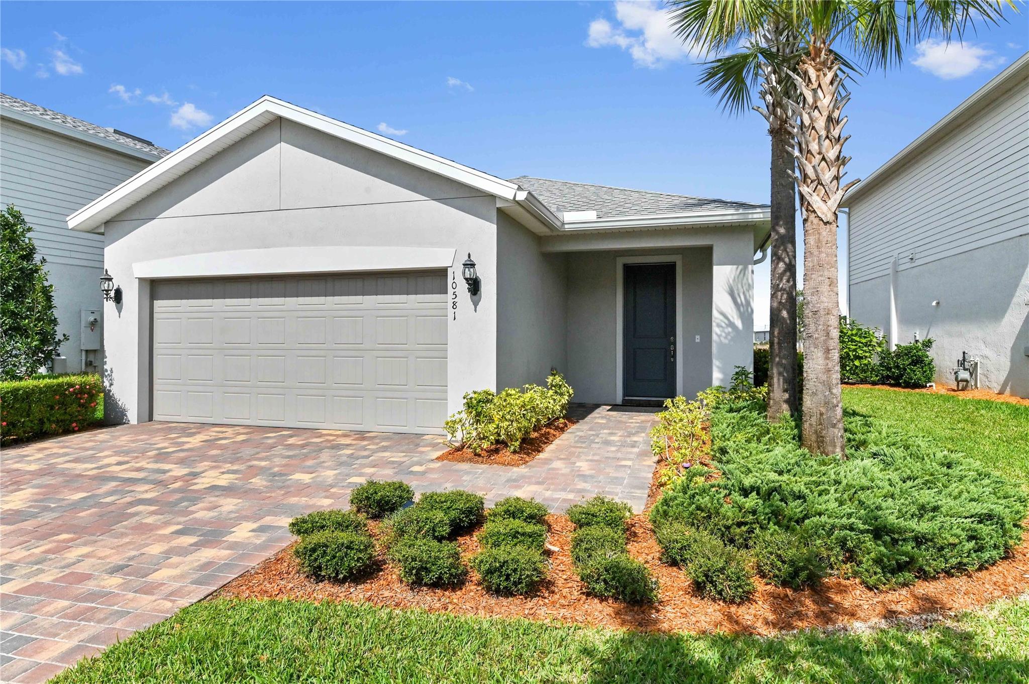 Beautifully maintained 3BR/2Bath + bonus room in highly desirable Heron Preserve at Tradition. Energy-efficient, smart home w/impact windows & doors, quartz countertops, gas appliances w/open floor plan w/abundant natural light, primary suite w/walk-in closet, ensuite bath & new carpet. Spacious Kitchen w/42" cabinets & island & room for coffee bar. Large laundry room. Covered screened lanai w/preserve view. Utility tub in 2 car garage. TAEXX Pest Control System. Gated community w/HOA provides cable w/HBO, high speed internet, lawn care, resort - style pool and playground. CDD bond paid off. Located near Tradition's town center, the Heart with shops, dining, parks, Cleveland Hospital, close to 95 and Turnpike and beaches. Home is move in ready with perfect blend of comfort and convenience.