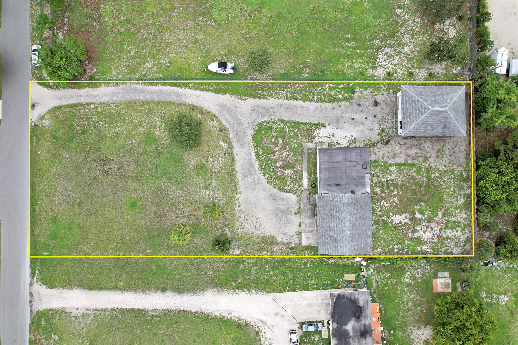 Rare opportunity to own a .87 acre lot minutes from I-95. Featuring a 3 bedroom home, attached 2 car garage and a 1200 square foot detached workshop this property has endless possibilities. Located just off of Forest Hill Blvd in one of Palm Beach Counties most desirable neighborhoods. With space big enough for a pool, Rv and all your toys, this one will go fast.Home is in need of renovation.Interior measurements are approximate.