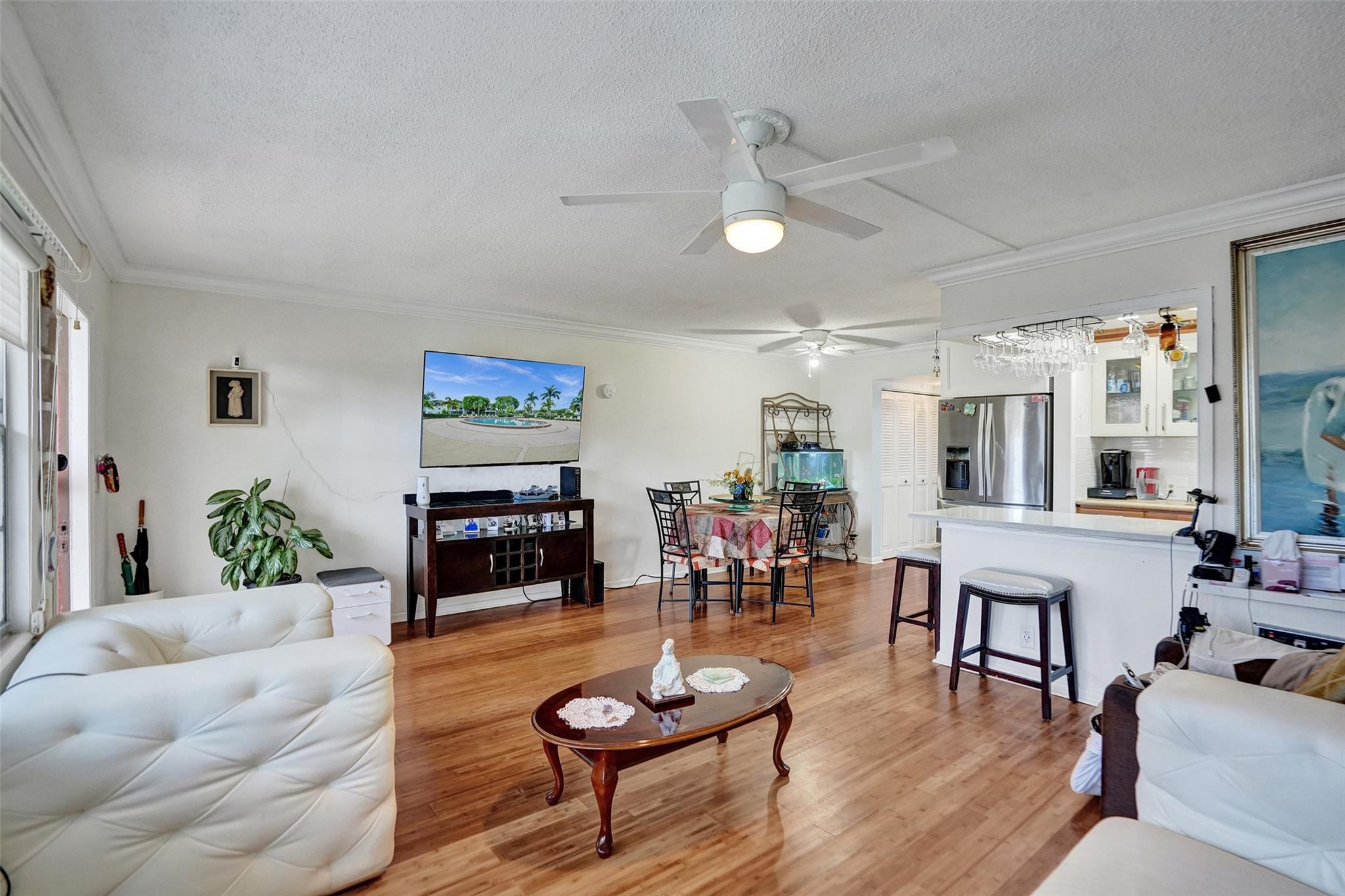 Located on a first-floor, this 1-bedroom, 1.5-bath condo in one of Boca Raton’s most desirable 55+ communities. As you walk in, you're welcomed by a bright, open living and dining area that feels airy and inviting. The kitchen is just off to the side with everything within easy reach.
The spacious bedroom features its own full bath along with direct access to a screened-in porch overlooking lush greenery. The space also includes a convenient half bath, great closet space, and neutral finishes add to the comfort and ease of living.
Set in a quiet, well-kept community with walking paths and amenities nearby, this home is ideal for year-round living or a seasonal retreat.