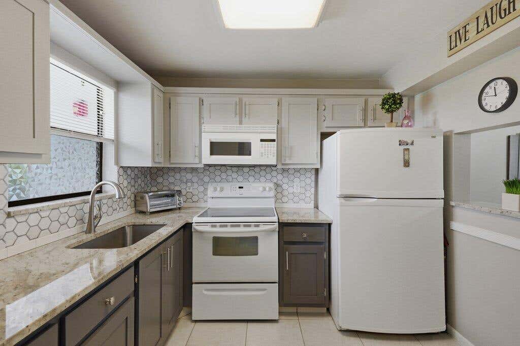 Photo of 4640 Lucerne Lakes Boulevard W #404, Lake Worth, FL 33467 (MLS # B26061171)