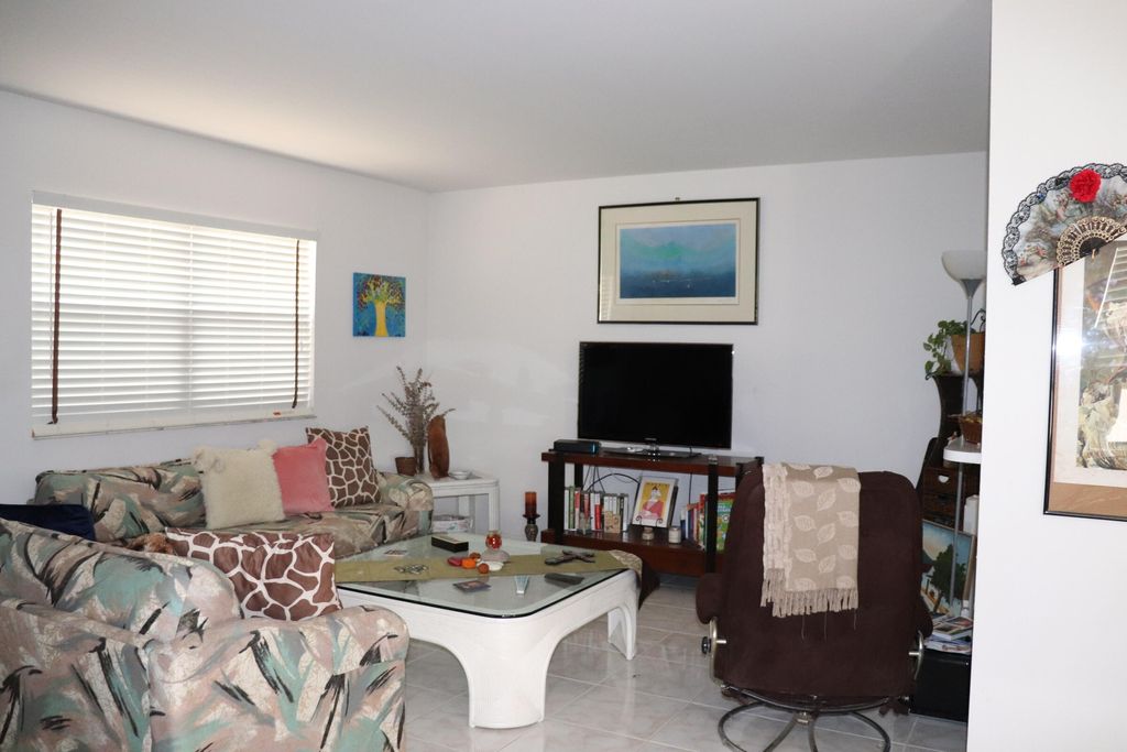 Photo of 26 Brittany Ct #A, Delray Beach, FL 33446 (MLS # B26015190)