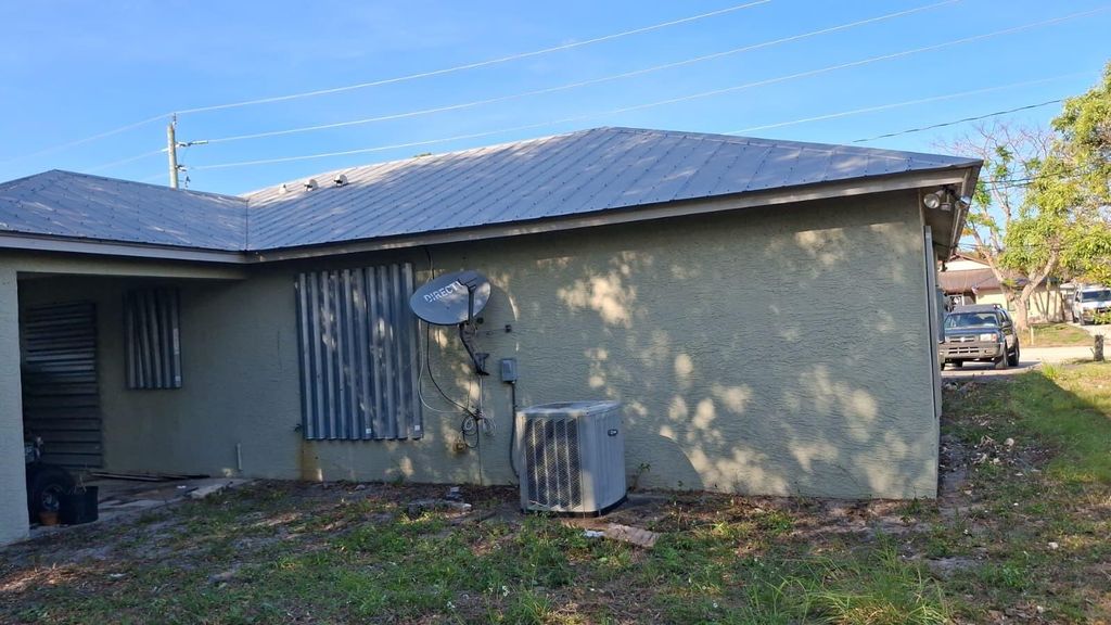 Photo of 5060 SE Ebbtide Avenue, Stuart, FL 34997 (MLS # B26023163)