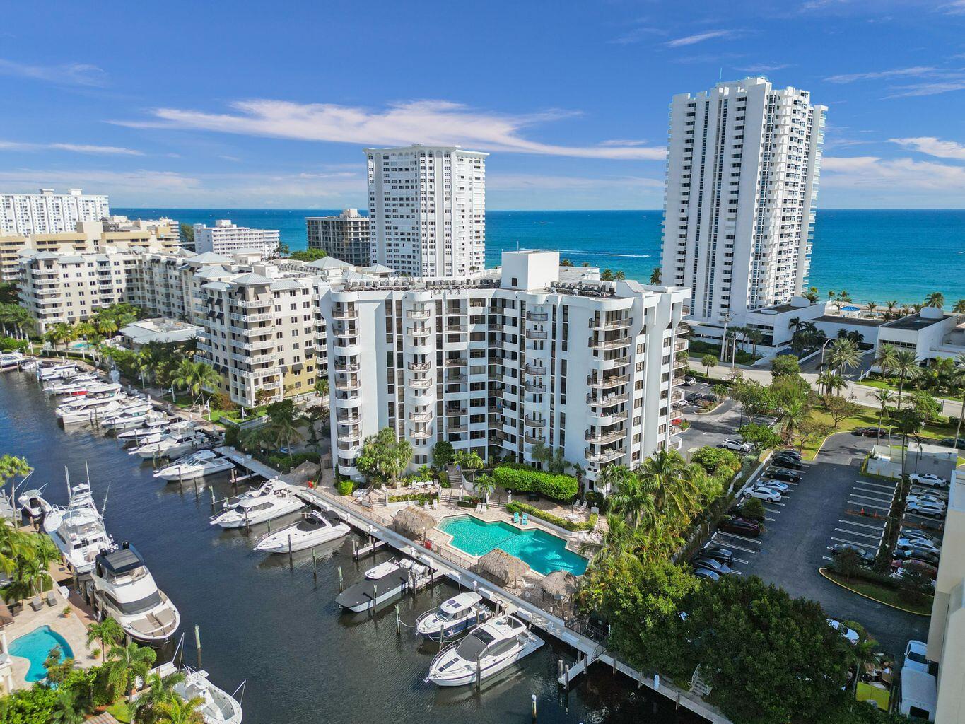 BOAT DOCK INCLUDED! Rare opportunity with exclusive-use dock (up to 35ft) just 20 mins to Hillsboro Inlet--includes dock water & 30/50 amp shore power. Spacious corner unit with panoramic views of the canal, Intracoastal & ocean. Two assigned parking spots (one covered). Gated, boutique building on A1A with private beach access. Features updated kitchen & baths, in-unit washer/dryer, huge walk-in closet & two balconies. Resort-style amenities: pool, hot tub, grills, tiki hut, gym, sauna, game & bike rooms, attended lobby & more. Won't last!