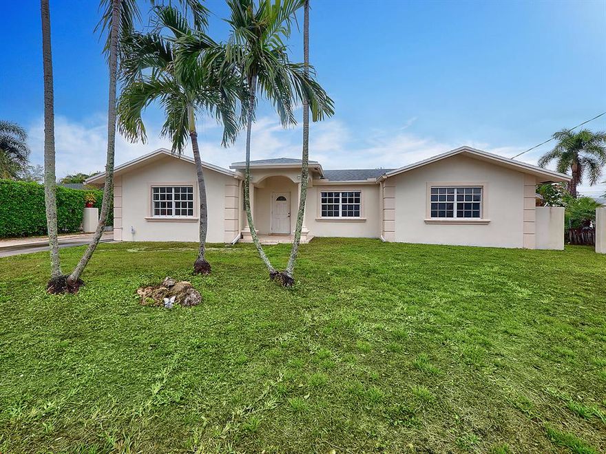 Large 3 Bedroom 2 Bath home centrally located. Newer kitchen with stainless steel appliances, granite counters, and tile backsplash. Tile and terrazzo floors throughout the home. Formal living room with electric fireplace. Extra large family room with built in shelves. Large yard with a lake view.