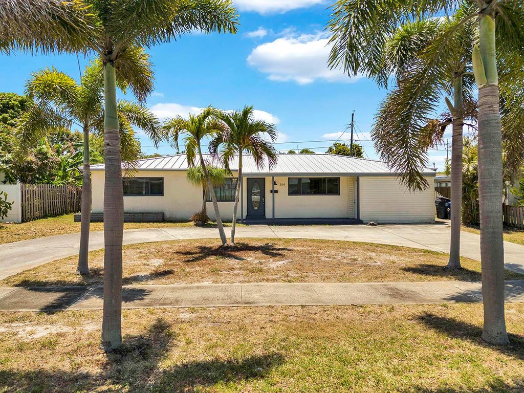 Photo of 344 E Jasmine Drive, Lake Park, FL 33403 (MLS # R11086063)