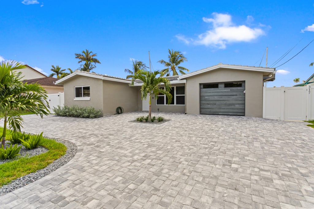 Photo of 317 NE 3RD Avenue, Dania Beach, FL 33004 (MLS # B26057388)