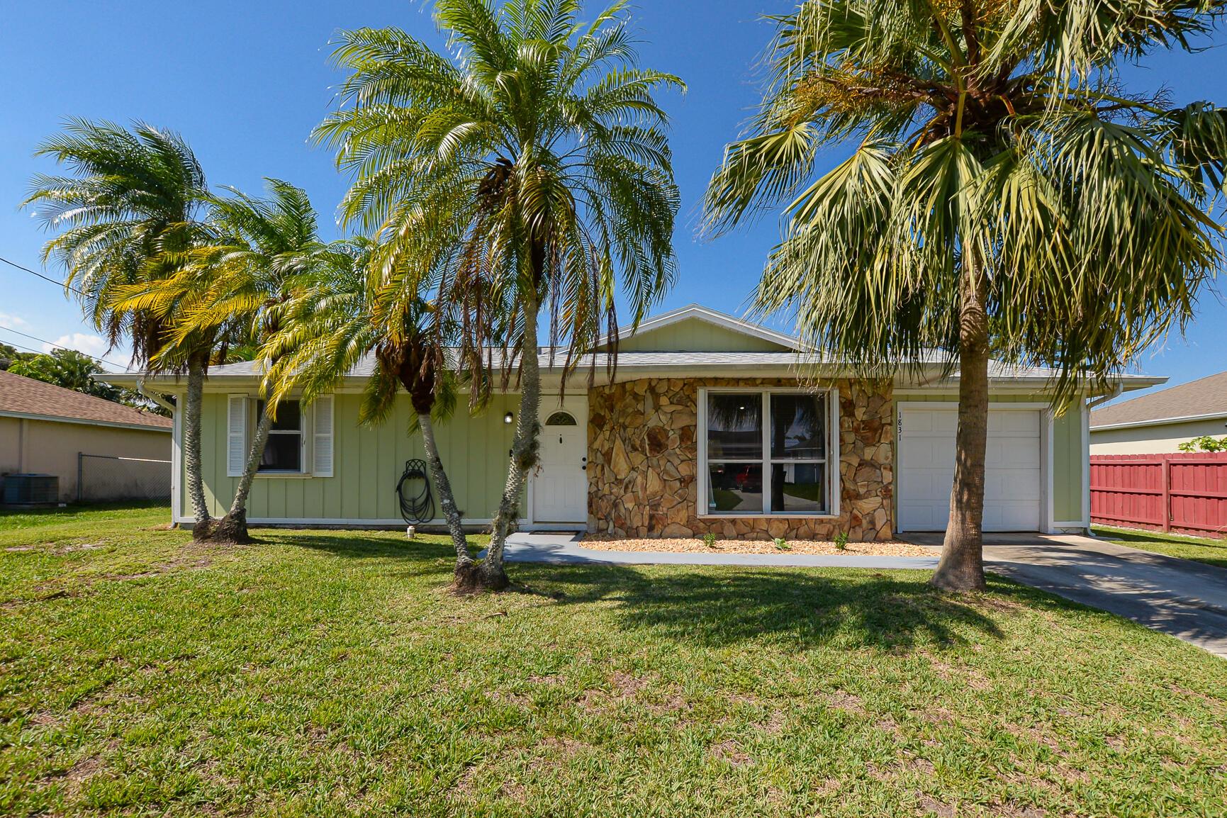 Welcome home to this beautifully renovated 2-bedroom, 2-bath, with garage, single-family gem nestled in a quiet Port Saint Lucie neighborhood. Thoughtfully designed living space offers the perfect blend of comfort, style, and functionality.Step inside to find a bright, open layout with all-new flooring, fresh interior and exterior paint, granite counters, and a completely updated kitchen featuring brand-new appliances. Both bathrooms have been tastefully renovated, making this home truly move-in ready.Enjoy Florida living on your screened porch overlooking a spacious fenced backyard--perfect for pets, gardening, or future pool plans. There's even extra room for creating your own garden oasis! And if you need to park your boat or enclosed trailer, there's room for that, too!