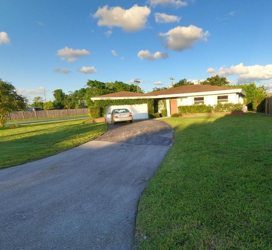 NO HEAVY LIFTING HERE.... Accordion Shutters on all windows and doors!  This Corner lot 3 BEDROOM/2 BATH home has an open living/dining concept with new carpet in 2 of 3 bedrooms and new AC unit. Conveniently located close to the turnpike, shopping and downtown West Palm Beach.
This will go fast!  Must See!!