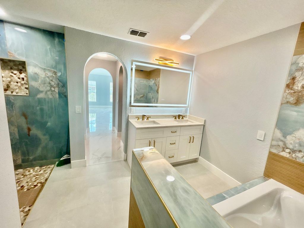 Photo of 3933 SW Kakopo St, Port Saint Lucie, FL 34953 (MLS # F10552549)