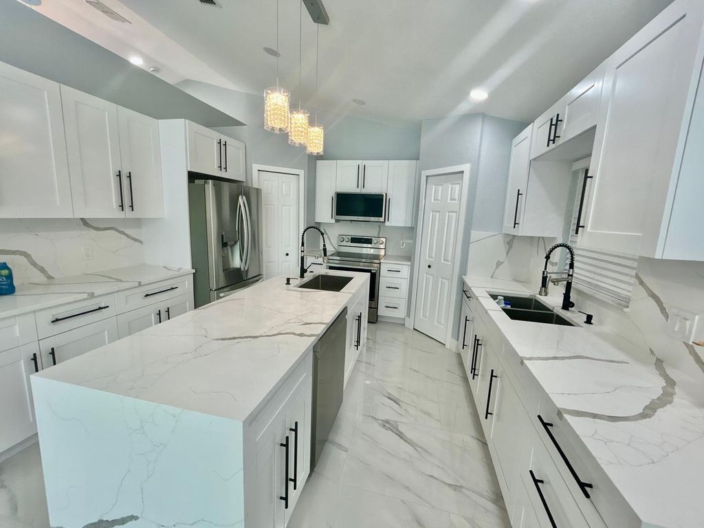 Photo of 3933 SW Kakopo St, Port Saint Lucie, FL 34953 (MLS # F10552549)