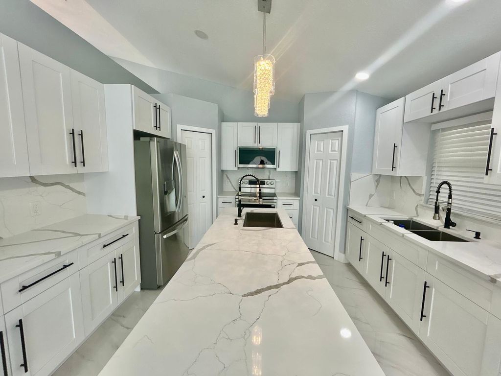Photo of 3933 SW Kakopo St, Port Saint Lucie, FL 34953 (MLS # F10552549)