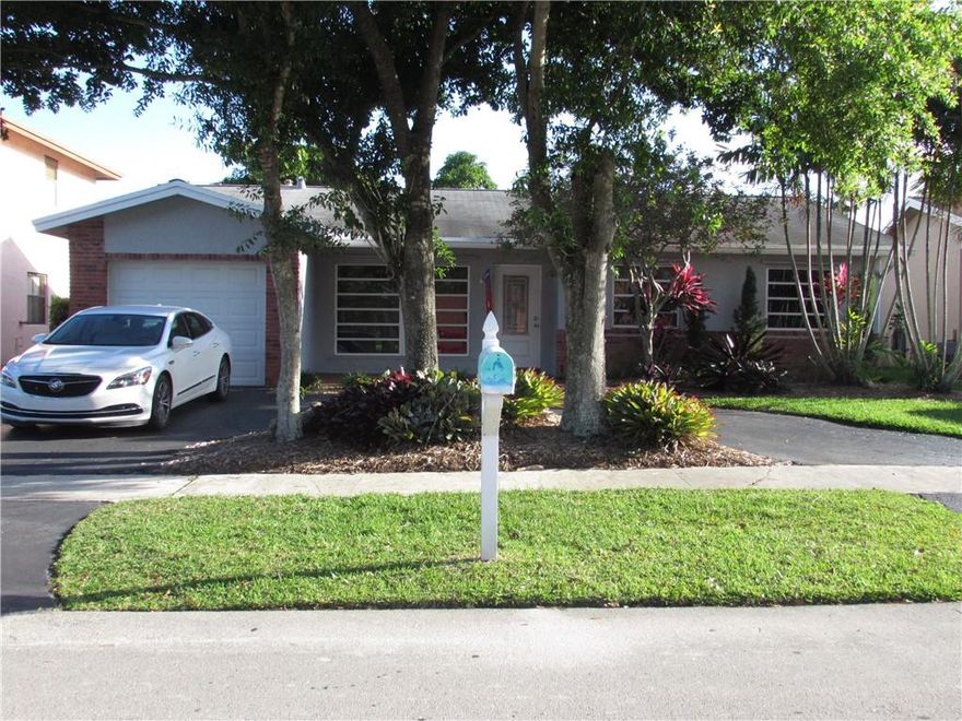 This gorgeous 3 bed, 2 bath, 1 car garage home features a spacious layout with tile flooring throughout living areas. Vaulted ceiling in living room. Kitchen updated with granite counter tops and high end stainless steel appliances. Upgraded bathrooms. French doors to patio. Fenced backyard. Landscaping has irrigation system. Relax by the heated pool all year long. Situated in desirable family neighborhood 1 block from the Sunrise Athletic Complex and park. A perfect location right next to the Sawgrass mall/restaurants and all major highways.NO HOA!!!