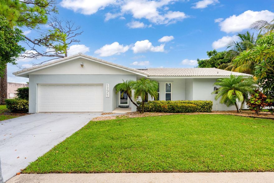Nestled in the highly sought-after community of Boca Raton Square, this home is a true gem offering both style and function. Step inside and be greeted by the warm glow of new vinyl flooring and the sleek, modern feel of stainless steel appliances and updated light fixtures. The kitchen is a chef's delight, complete with beautiful countertops that provide ample space for meal prep and entertaining. With impact windows and doors throughout, you can enjoy peace of mind and energy efficiency. The layout is perfect for flexible living, with two bedrooms boasting their own full en-suite bathrooms, offering a private retreat for guests or family members.