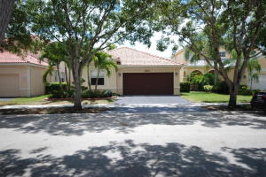 Gorgeously upgraded, immaculately maintained single story open floor plan home in luxury gated family community located on a cul-de-sac. Impeccable high-end kitchen includes polished stone counters, gorgeous glass tile backsplash & sleek, modern design cabinets, sub-zero refrigerator & stainless appliances. Fabulous spa-like bathrooms include tile showers w/ frameless doors, gorgeous fixtures, dual sink in master, stone counters & soaking tub. Limestone & tile floors throughout, custom closet built-ins in all bedrooms & custom lighting throughout. Private backyard. WOW! Excellent schools, close to shopping, business and I-75.  Community is 24-7 guard gated w/ luxury clubhouse,  community pool, BBQ Area with tiki huts, and Tot Lots!  This is a MUST SEE