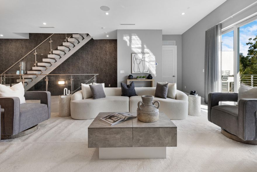 This luxury three-story townhome offers 3 bedrooms, 3.5 bathrooms, plus a den/office, located within the gated community of Beverly Heights and just a five-minute walk from Las Olas Boulevard. Designed for modern South Florida living, the home features a private pool, two-car garage, full impact windows and doors and elevator access to all levels.

The main living area is anchored by a chef's kitchen featuring a gas range, a full suite of high end German appliances, wall oven, and a large island with a waterfall-edge countertop, creating a seamless space for both everyday living and entertaining. A reverse osmosis system and whole-house water filtration add an elevated level of comfort and quality.

All bedrooms are true suites with dedicated en suite bathrooms, offering privacy and flexibility. 

The expansive primary suite includes a private balcony and a spa-inspired bathroom with a large walk-in shower and a separate soaking tub.

Outdoor living continues with a second-floor balcony featuring a built-in summer kitchen with grill, sink, and refrigerator, ideal for relaxed dining and entertaining. With new construction, premium finishes, and an unbeatable walkable location near dining, shopping, and nightlife, this home is perfectly suited for full-time living or a lock-and-leave lifestyle.

From morning coffee on Las Olas to sunset walks along Fort Lauderdale Beach, this location makes everyday life feel like a getaway. Enjoy walkable access to renowned dining, workout studios, and lively nightlife. Approximately one mile to Publix, two miles to Whole Foods, & effortless travel with FLL Airport roughly five miles away, MIA Airport approximately 30 miles south, and PBI Airport about 45 miles north.