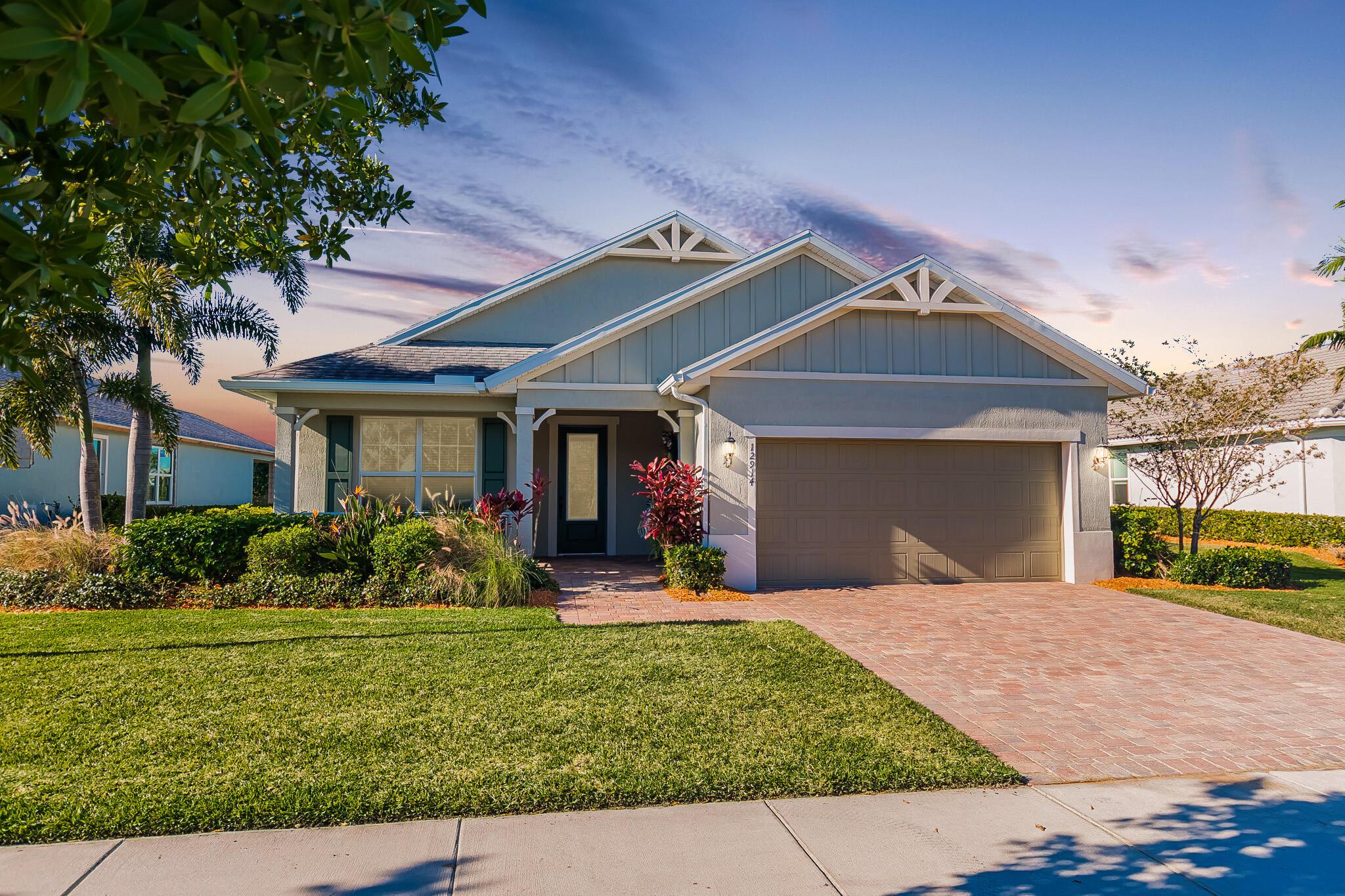 Welcome to this exquisite former model home, lakefront 2/2/2 w/flex room in DelWebb 55+ gated community. Every corner of this home is graced with over $100k in luxurious upgrades and finishes, from the crown molding, tray ceiling and custom wood trim to the rich wood-look plank tile floors that flow seamlessly throughout. The gourmet kitchen is a chef's dream, showcasing quartz countertops, huge island, ample 42'' wood cabinetry with pullouts, stainless appliances, gas cooking, raised dishwasher. A walk-in butler's pantry, complete with a wine cooler. Step outside into the covered paver lanai for year-round enjoyment. The picture frame screen and sunshades create a tranquil oasis. High impact glass. State of the art amenities including 2 Clubhouses, pools, fitness centers, pickleball, mo