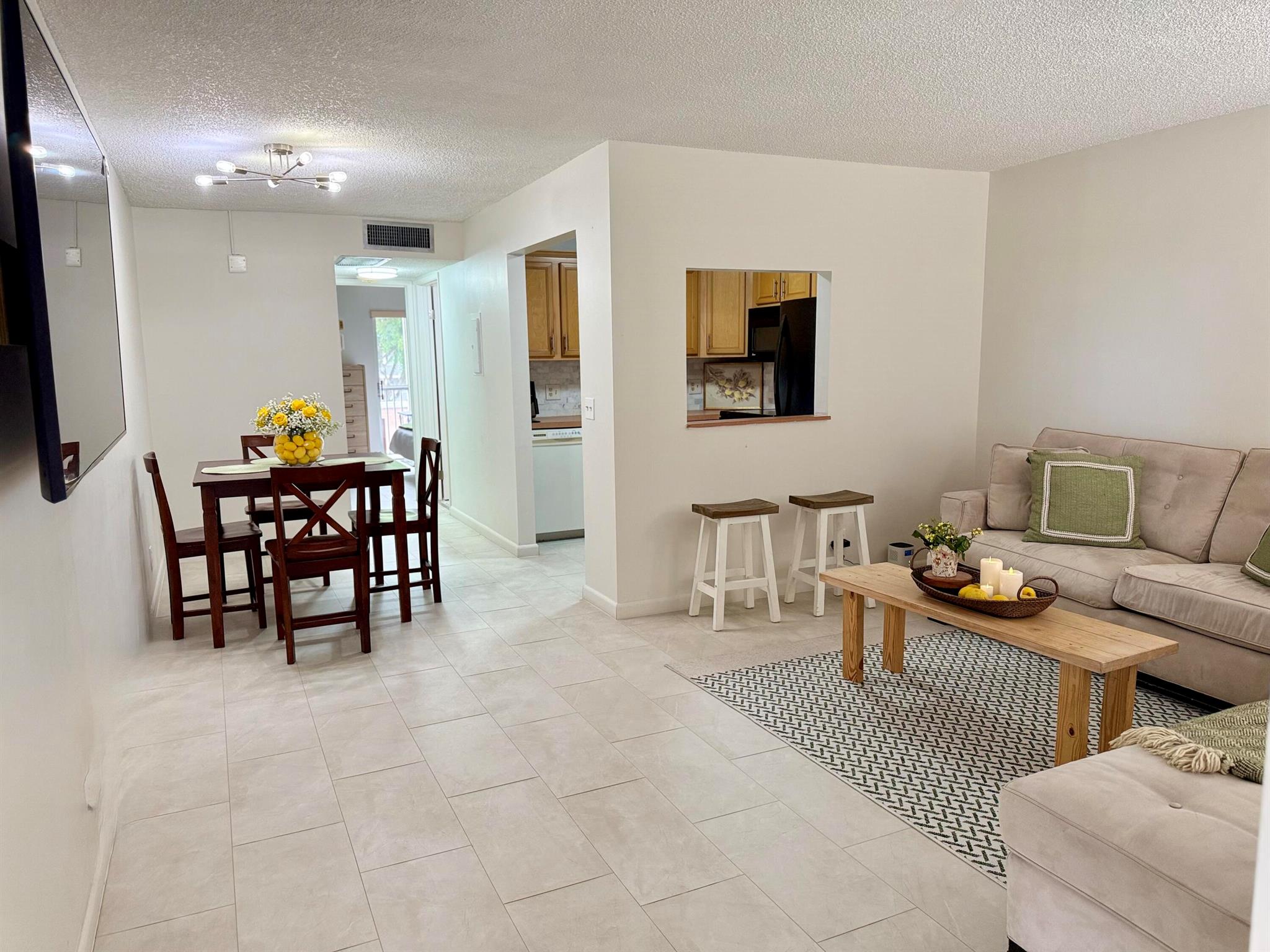 Beautiful and well-maintained condo in a highly desirable 55+ community. This bright and spacious unit offers stunning views of the pool area with no rear neighbors, ensuring added privacy and tranquility. Featuring updated flooring and fresh paint throughout, the apartment is move-in ready. Conveniently located directly in front of the stairs and elevator for easy access. The community is known for its safety, peaceful atmosphere, and excellent amenities, including a pool, cabana, laundry facilities, individual storage, and dedicated bike storage.