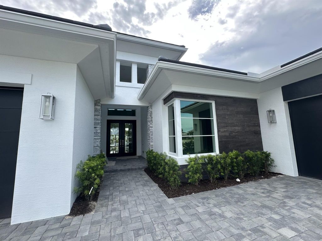 Photo of 9112 Coral Isles Circle #{Lot 04}, Palm Beach Gardens, FL 33412 (MLS # R11049183)