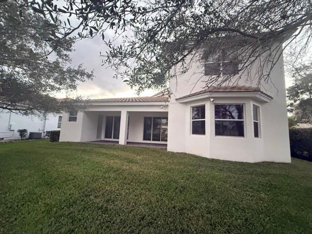 Photo of 182 Palm Beach Plantation Blvd, Royal Palm Beach, FL 33411 (MLS # F10541558)