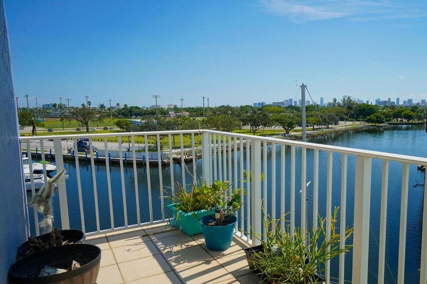 RARE Miami Condo with Washer & Dryer Inside, along with TWO Assigned Covered Parking Spaces. Astonishing Water Views of the Miami River and City Skyline from this incredible corner unit in River Run South Condominium.  This unique property has dual balconies off the living room and the master bedroom, offering tranquil views of the sunrise and passing ships. The kitchen is equipped with modern Samsung appliances and the split floor plan allows for privacy between both bedrooms and bathrooms. River Run is a GATED community in a great location, just a few miles from Wynwood, Brickell, and only ten minutes from Miami International Airport.