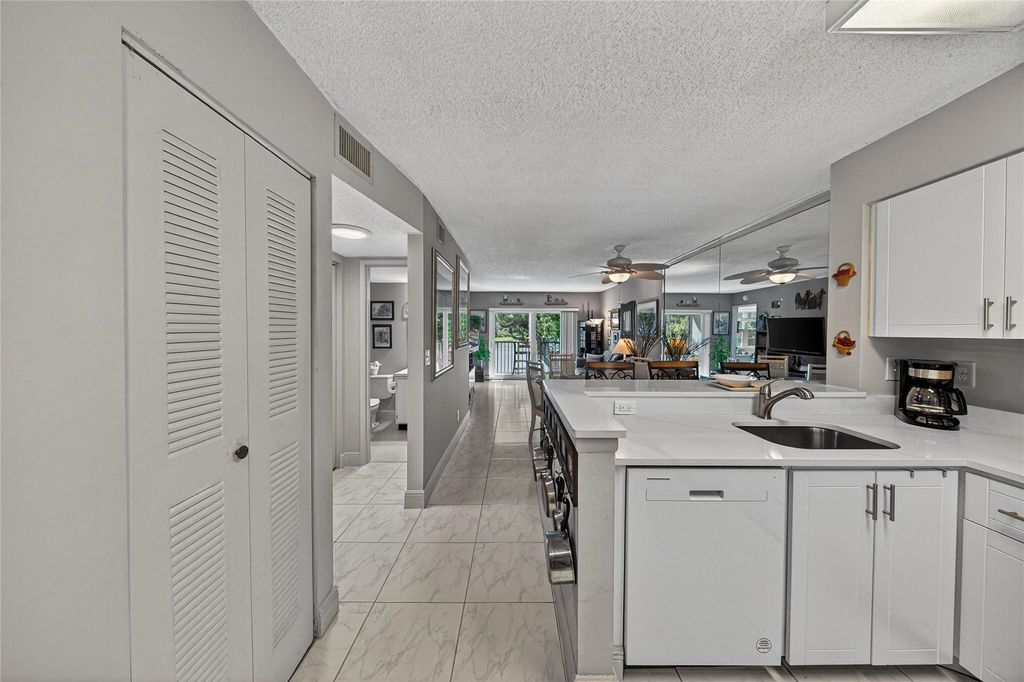Photo of 2222 N Cypress Bend Drive #201, Pompano Beach, FL 33069 (MLS # B26032163)