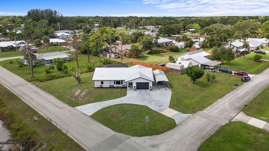 Pool home on oversized .39-acre corner lot in Lakewood Park. Move-in ready with major upgrades including brand new A/C system(2026) , Metal roof (2025), water heater, pool enclosure, pool pump, well, and water softener all done in 2023. Beautiful oak floors installed in 2024. Tongue-and-groove ceilings add character, plus formal living and separate family room offer flexible living space.

Large fenced yard with gate entrance large enough for and RV, boat, and toys. Enjoy county taxes only and low HOA of just $75/year. Community amenities include tennis, basketball, softball, beach volleyball, soccer, and pickleball courts.

Conveniently located 10 minutes to Vero Beach, 15 minutes to Hutchinson Island, and 15 minutes to downtown Fort Pierce.