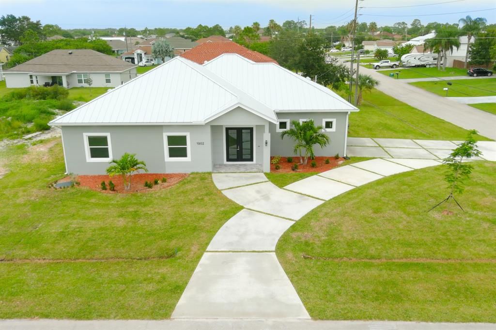 Photo of 1902 SW Guernsey Street, Port Saint Lucie, FL 34987 (MLS # R10732485)