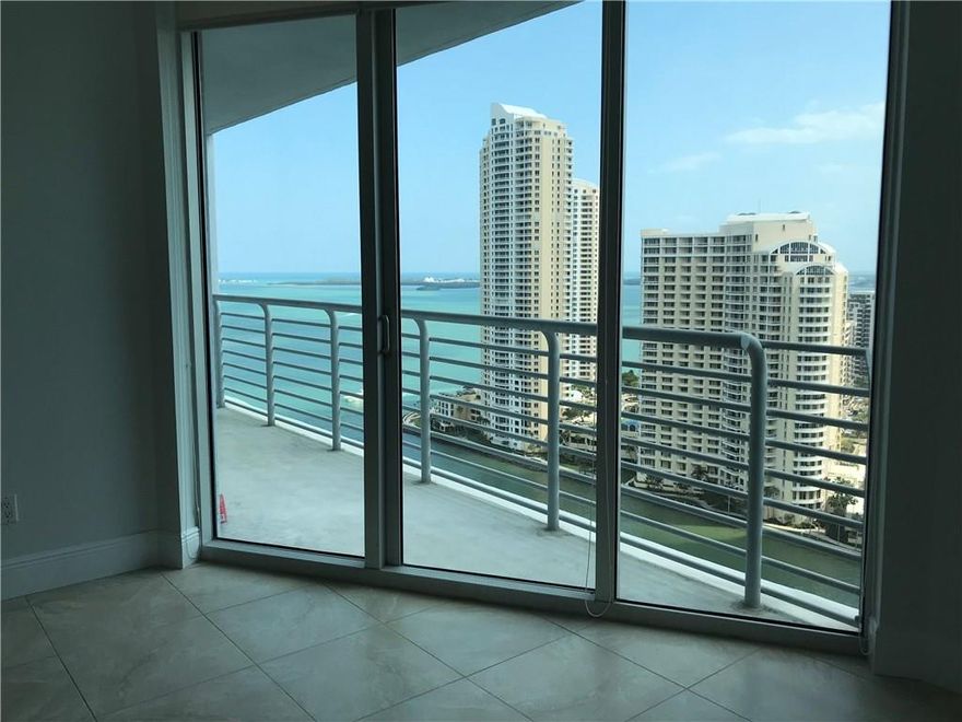 Spectacular views of the Miami River, Biscayne Bay and the Ocean. The unit has brand new ceramic tiles through the entire apartment, new baseboards, it has been entirely painted. It is move in ready! Amazing location, walking distance to great cafes/restaurants, Whole Foods, Bayfront Park and Bayside Marketplace. Minutes to Brickell, SoBe and Design District. Beautiful common areas such as multiple pools overlooking the bay, gym, sauna and so on.
