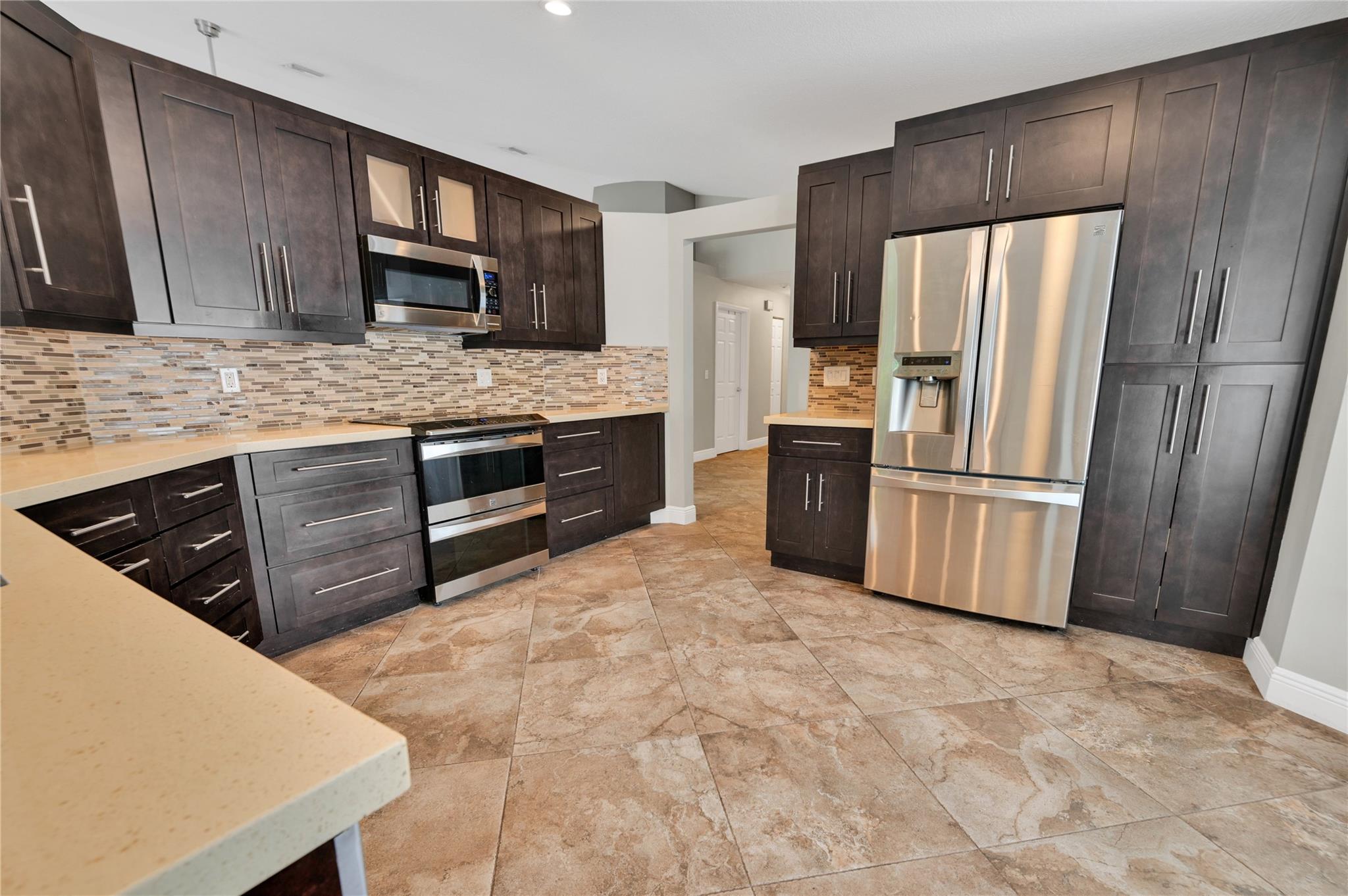 Welcome home to this beautiful home with 4 bedrooms, 2 bathrooms, a heated pool with a peaceful backyard
located in the sought after Coral Trace neighborhood in Coral Springs. This home boasts a fully fenced, large
private backyard with a heated pool with plenty of room for entertaining friends and family. Pet friendly. This
home is in a beautiful community with quick access to major roads, houses of worship, all things shopping, dining and more. Pets okay. Available for immediate occupancy. Rapid approval.