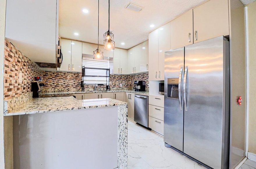 Priced to sell! Unbeatable price for a well-maintained 4-bedroom in Boynton Beach. Don't miss this well-maintained 4-bedroom home in minutes from the beach, featuring NO HOA, abundant parking, new flooring throughout, a new roof, and an upgraded kitchen. A rare find offering both value and convenience.