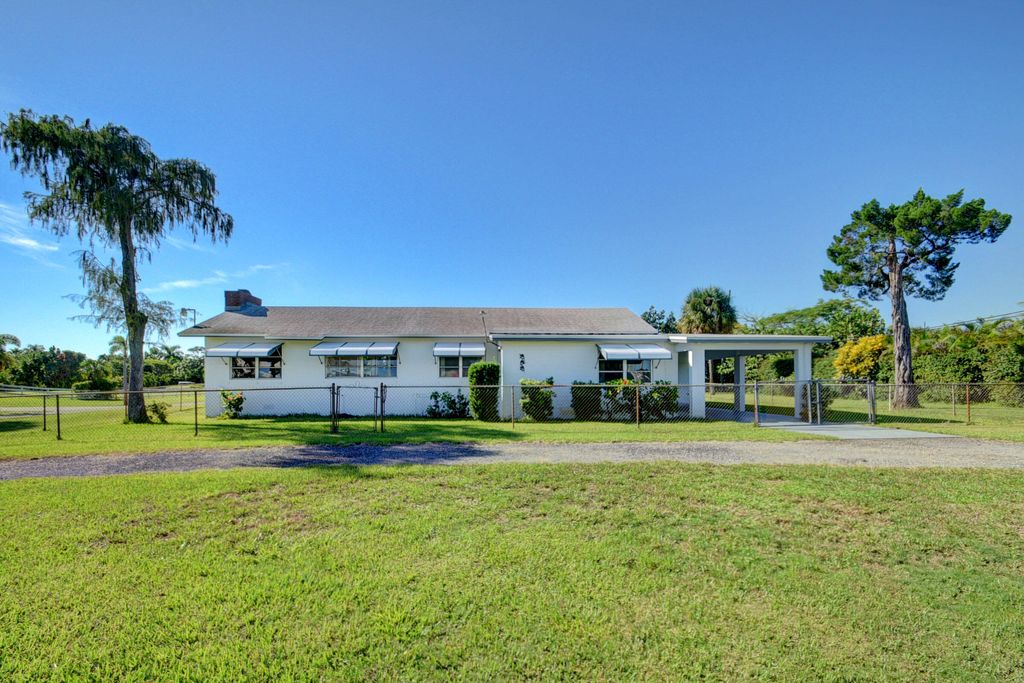 Photo of 6698 Belvedere Road, West Palm Beach, FL 33413 (MLS # R11169193)