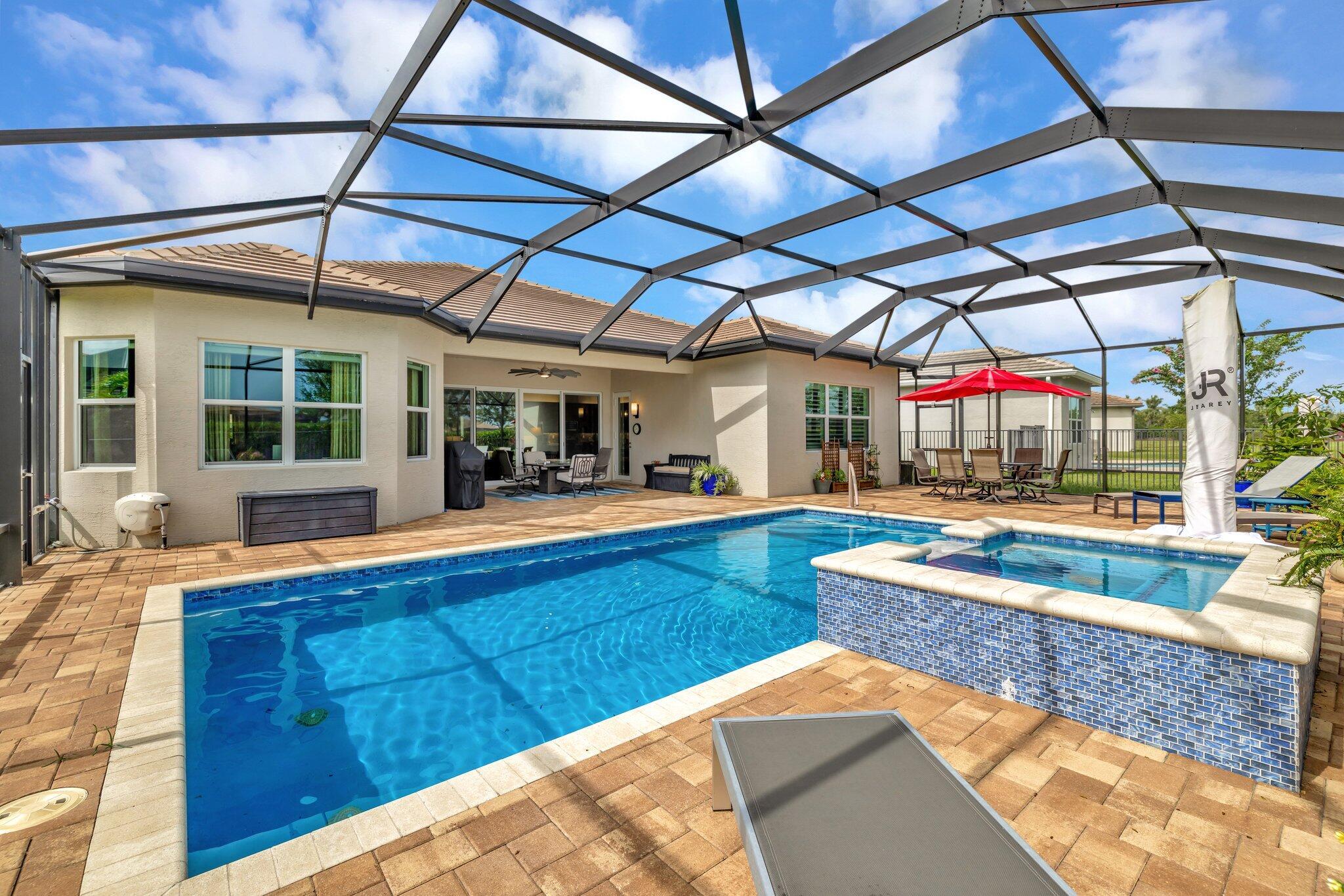 Experience refined luxury living with the Bianca Model at Valencia Cay in Riverland. This elegant pool home, situated on a private lot, features 2 bedrooms +den/3rd bedroom, a family room, a spacious living area, a two-car garage, and a dedicated golf cart garage to enhance ease of transportation within the community. Thoughtfully designed for modern comfort and sophistication, this residence offers open-concept living, high-end finishes, and generous interiors ideal for an active, upscale lifestyle. Highlights include an expansive great room tailored for entertaining, a gourmet kitchen equipped with premium cabinetry and stainless-steel appliances, and a luxurious master suite featuring walk-in closets and a spa-inspired bathroom, with a large shower and separate