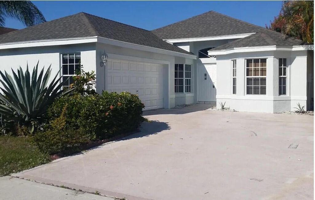 Photo of 103 Saratoga Boulevard E, Royal Palm Beach, FL 33411 (MLS # R11160618)