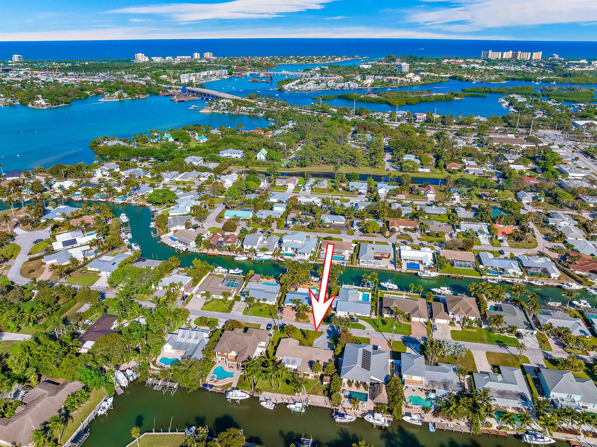 Welcome to 930 Dolphin Drive! Offering 100 feet of waterfrontage, 3 bedrooms, 2 full baths, a large walk-in owner's closet, separate laundry room, separate utility room and a two-car garage, this property is ready for its new owner. With the recent addition of the new owner's suite, this house is ready for you to move in and keep it as-is or continue the renovation. Located just minutes away from Jupiter's best shopping and dining!