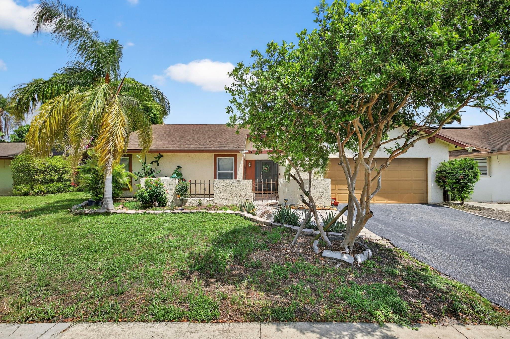 Fantastic home! Features an open-concept kitchen, vaulted wood beamed ceilings & dramatic skylight. Screened tiled patio with 2 ceiling fans. Mexican tile throughout. Fireplace in living room. Fenced yard with pool. Impact windows. Vaulted master bedroom with walk in closet and sliding doors to walk out to the patio. Master bathroom walks out to pool. 2 car garage. No HOA. Don't miss this one!
