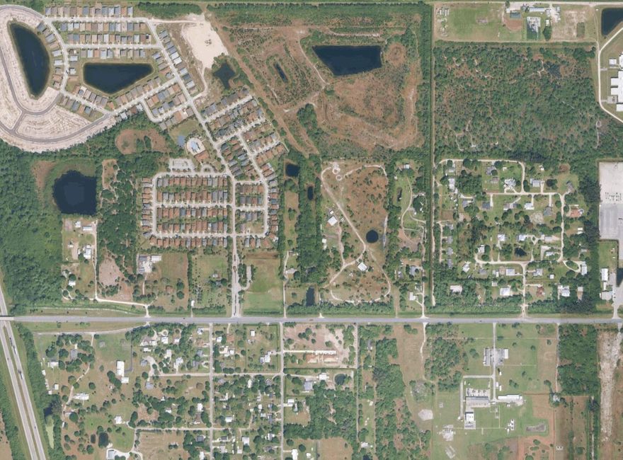 Discover the perfect blend of space, flexibility, and rural charm with this unique property in Fort Pierce. Situated on approximately 4.5 acres, this expansive parcel offers endless possibilities for those seeking privacy, room to grow, or agricultural use.  The CBS constructed property provides a peaceful setting surrounded by open land, making it ideal for farming, gardening, livestock, or creating your own private retreat. With agricultural use permitted, you have the freedom to bring your vision to life—whether it's a small farm, nursery, or simply enjoying wide-open space. The residence offers comfortable living accommodations with a functional layout, while the surrounding acreage provides ample room for additional structures, equipment, or recreational use. The electrical panel and two water heaters were updated in 2024.  Enjoy the tranquility of country-style living on this property with two stocked ponds while still being conveniently located near major roadways, shopping, and dining in Fort Pierce.  This is a rare opportunity to own a sizable piece of land with versatile use options in a growing area of the Treasure Coast.  Bring your animals, equipment, and ideas—this 4.5-acre property is ready to make your vision a reality!