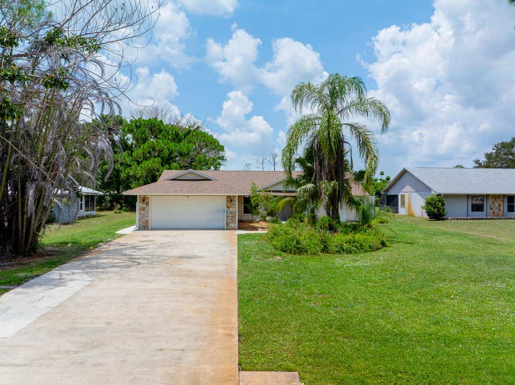 Photo of 5803 DEER RUN Drive, Fort Pierce, FL 34951 (MLS # B26058033)