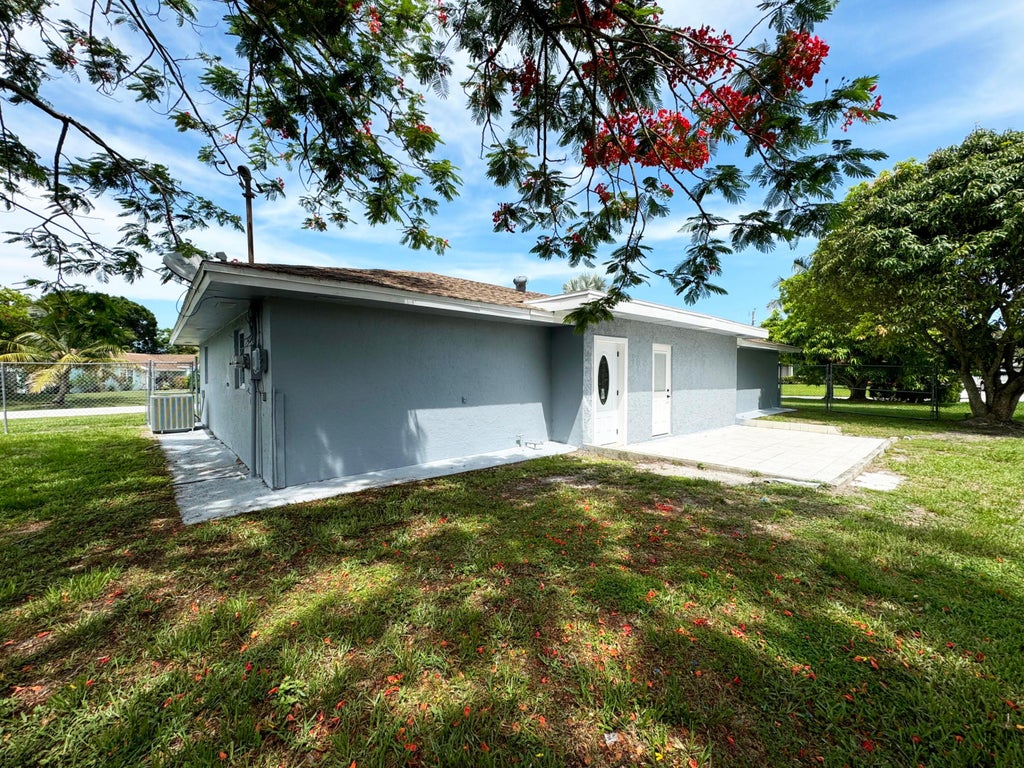 Photo of 702 NE Lanfair Street, Port Saint Lucie, FL 34983 (MLS # B26042743)