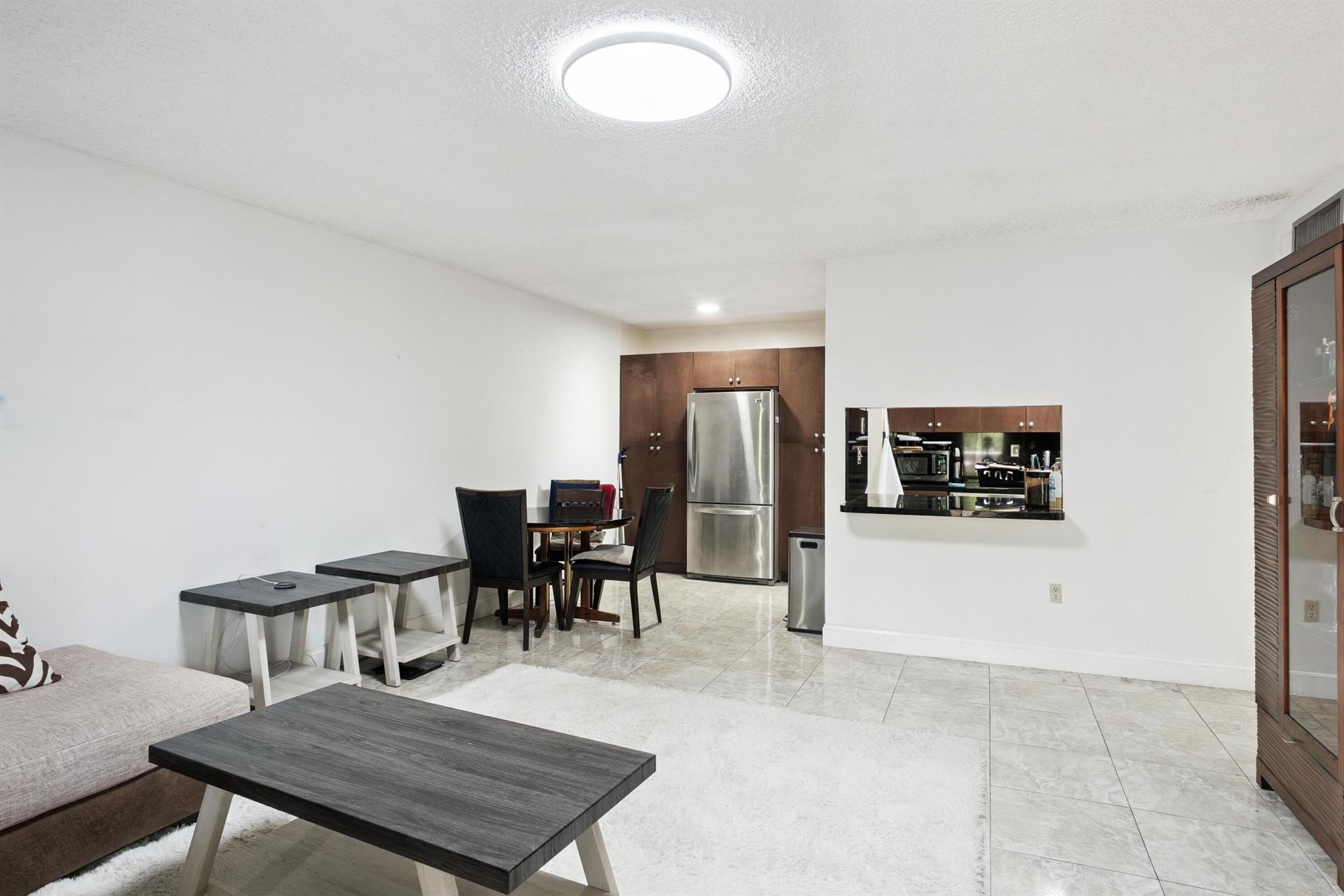 WELCOME TO THIS BEAUTIFULLY APPOINTED 1 BR, 1 BA CONDO- A PEACEFUL RETREAT IN THE HEART OF HOLLYWOOD!If you've been searching for tranquility and convenience, look no further. This bright and spacious unit is perfectly located near I-95, the Florida Turnpike, Hard Rock Casino, and plenty of shopping and dining options. Enjoy the added convenience of an in-unit washer and dryer, along with a secure lobby entrance that provides peace of mind.All ages are welcome!This is a fantastic opportunity for first-time buyers or those looking for an affordable primary home in Hollywood's vibrant 33024 corridor. Rentals are not permitted, making this an ideal owner-occupied residence for those seeking a quiet, community-focused lifestyle. ****PASSED THE MILESTONE INSPECTION*** ROOF 2024