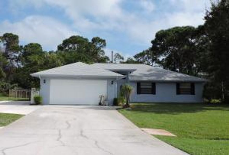 Great wheelchair accessible home with ramps, wider doorways and extra wide driveway. This 3/2/2 home is in a quiet neighborhood with upgrades in 2012 that include new roof, kitchen, a/c, water heater, front door and appliances! House just painted in December 2015. Well water for irrigation. Wood/tile through house with carpet in 2 bedrooms. Ramps lead to covered porch with tile floor. Plenty of room for a pool with a private backyard. BY APPOINTMENT ONLY - 24 HOURS NOTICE REQUIRED. ''As-Is