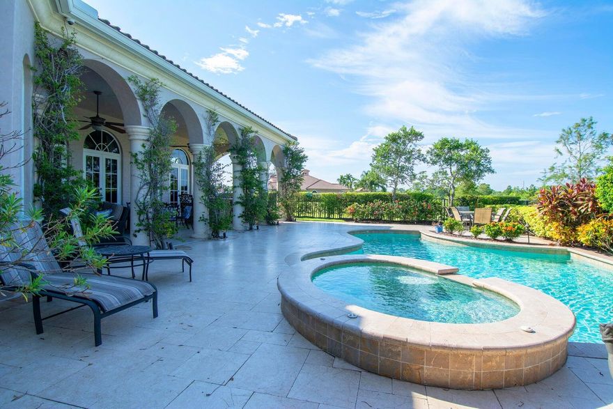 Experience privacy in this fully furnished and turnkey Tuscan-style home. The 37ft. long covered porch overlooks a newly resurfaced lap pool with a hot tub & features an outdoor kitchen with a natural gas grill; the fire pit has views of a preserve, 16th fairway & pond. 5 double French doors lead from the porch into the Great room & kitchen. The refinished marble floors accent all the indoor entertainment areas. The private office/den has wood floors. Each Bedroom with ensuite baths, designed for maximum privacy, has been updated with new carpets. The Main Bedroom suite has a 14 ft high tray ceiling, both his & her private baths, and 2 walk-in closets featuring custom cabinets. Updated AC's, New pool heater, Tankless water heater, EV Car & Golf Cart charger, 400 amp electric service